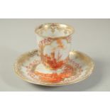 A GOOD BEAKER AND SAUCER, well painted with iron-red monochromes scenes of figures in a European