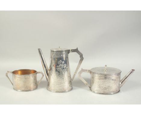 A GOOD ELKINGTON &amp; CO. OVAL SILVER TEA POT , HOT WATER JUG AND SUGAR BASIN  with a Chinese design and bead edge. Birmingh