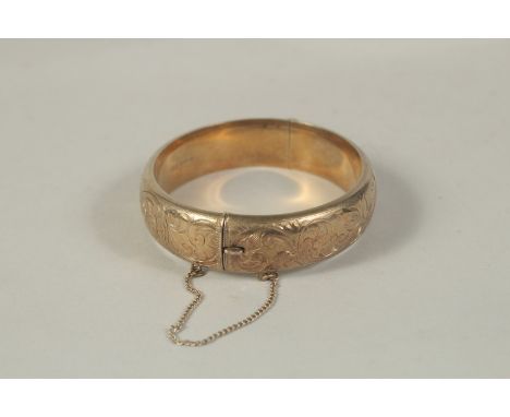 A GILDED SILVER BANGLE.