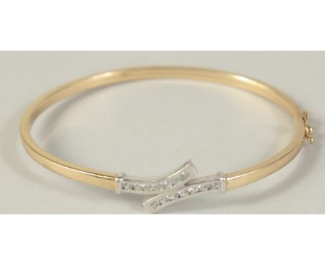 A 9CT GOLD BANGLE