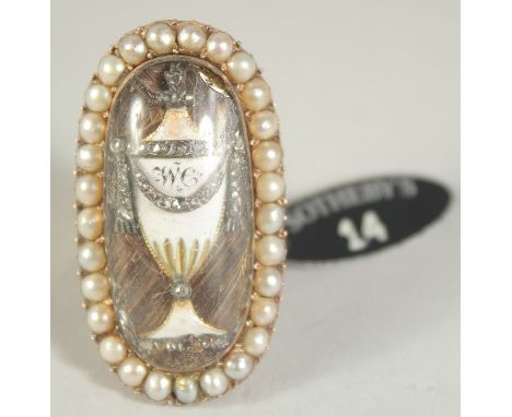 A GOOD GEORGIAN GOLD OVAL RING with enamel and surrounded by seed pearls. Provenance: bears Sothebys label.  Size M.