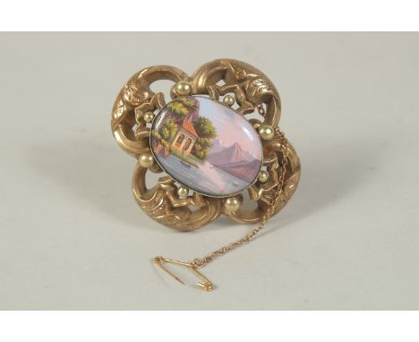 A VICTORIAN 9CT GOLD BROOCH with Swiss enamel pane and locket back