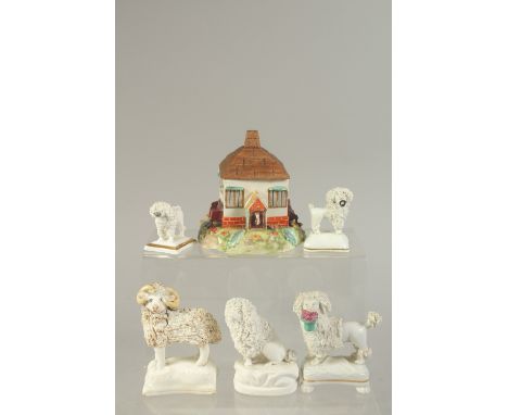 FOUR STAFFORDSHIRE TYPE POODLES, a similar ram and a ceramic cottage with wooden roof.