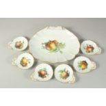A LARGE MEISSEN SHELL DISH decorated with fruit, 31cms x 24.5cm and SIX SCALLOPED SHAPE DISHES