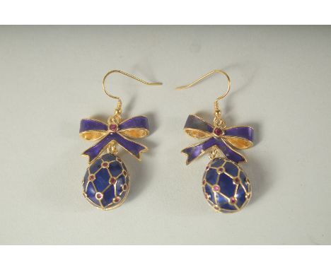 A GOOD PAIR OF RUSSIAN SILVER AND BLUE ENAMEL EGG EARRINGS with bow.