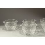 A GOOD SET OF EIGHT DOUBLE LIP BOWLS AND STANDS.