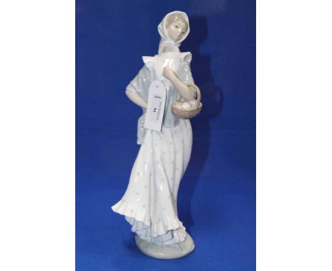 NAO FIGURE OF A LADY
in a polka dot dress and carrying a basket