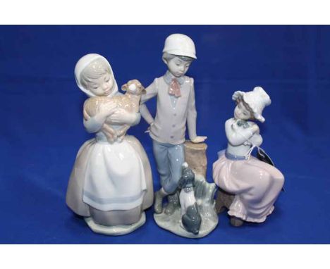 LOT OF 18 LLADRO AND NAO FIGURES 
including Lladro doves, Nao figures or children, etc