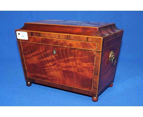 19TH CENTURY MAHOGANY SARCOPHAGUS TEA CADDY
with line inlay, four wooden ball feet, later brass lion head handles, three comp