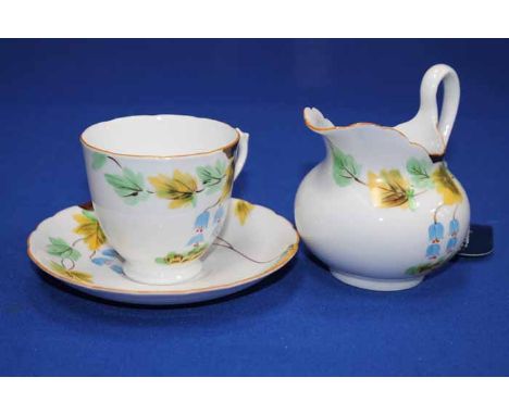 FLORAL TUSCAN BONE CHINA TEA SET
twelve cups, saucers, sideplates, two cake trays, cream and sugar, decorated with yellow and