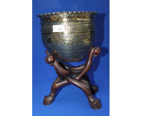 INDO-PERSIAN BRASS BOWL
decorated with scene of elephants and figures, on a wooden folding tripod style stand (2)