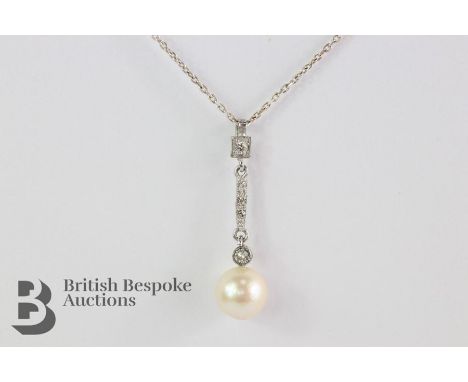 18ct white gold diamond and pearl pendant. The pearl measures approx 9mm in diameter, the white gold diamond encrusted bar se