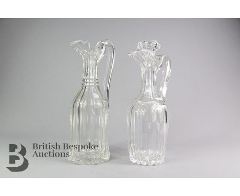 Two cut crystal decanters, one approx 34 cms h no stopper, the second is approx 31 cms h complete with stopper. (2)Note: smal