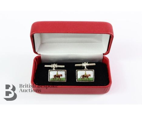 A pair of silver and enamel cufflinks, depicting a mounted figure, stamped 925, in a presentation box.&nbsp;