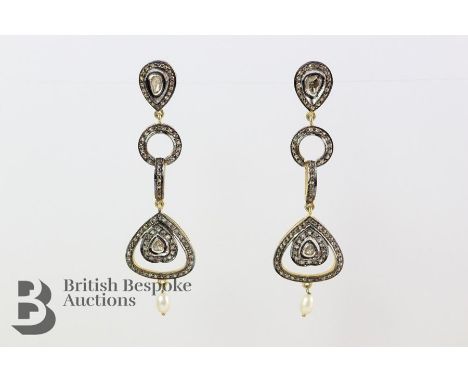 Pair of silver gilt diamond and pearl drop cocktail earrings, approx 6 cms drop.&nbsp;