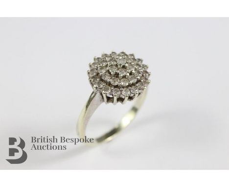 9ct white gold diamond cluster ring. The ring set with approx 90 pts of dias, size R, approx 4 gms.&nbsp;