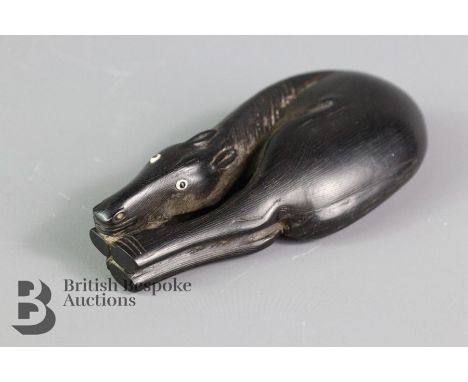 19th century ebony netsuke, finely carved horse, its head resting on its hooves, glass eyes, the coat rendered with very fine