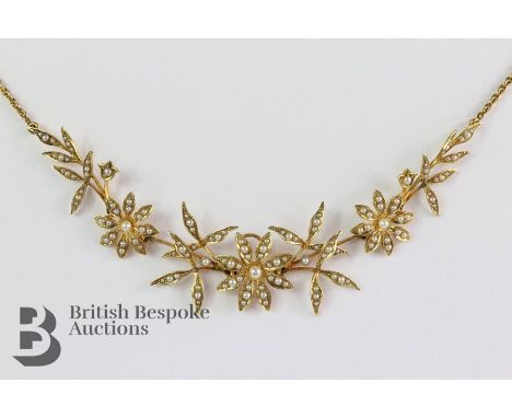Edwardian 15ct yellow gold and pearl floral necklace. The floral spray measures approx 135 x 20 mm, total length 40 cms, appr