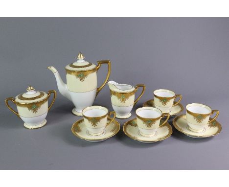 Early 20th century Noritake tea set, comprising tea pot, sugar bowl, milk jug and four cups and saucers. Note: gilding is in 