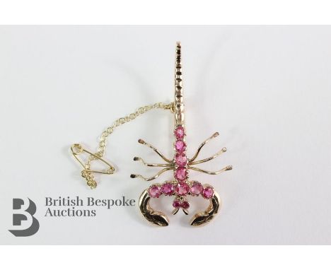 Gold and ruby scorpion brooch, the scorpion set with eleven graduated rubies, approx 50 x 30 mm. 