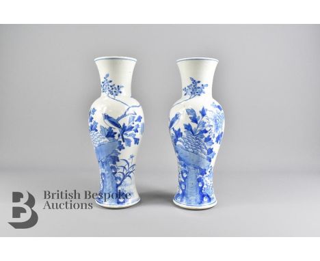 Pair of Chinese blue and white vases. The vases painted with birds amongst tree peony, approx 30 cms h, Kangxi marks to base.