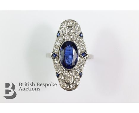 Art Nouveau platinum sapphire and diamond ring, set with an oval sapphire 11 x 7mm, surrounded by approx 1ct of claw-set diam