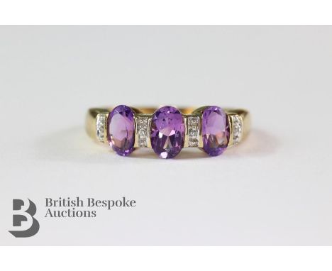 9ct gold (tested) diamond and amethyst ring. The ring set with three oval amethyst approx 6 x 4mm with approx 2 pts of eight-