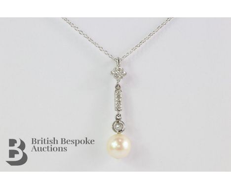 18ct white gold diamond and pearl pendant. The pearl measures approx 8.5mm in diameter, the white gold diamond encrusted bar 