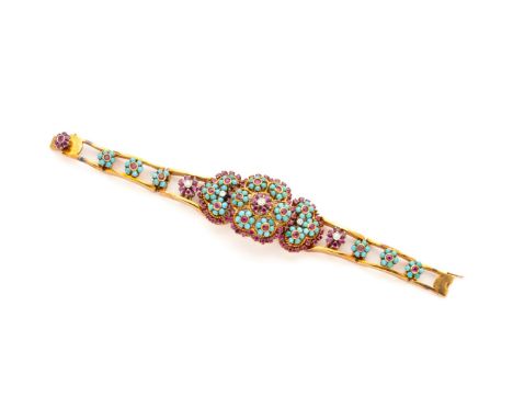 RUBY, TURQUOISE AND DIAMOND BRACELET centring on a foliate cluster of circular-cut rubies, cabochon turquoise and brilliant-c