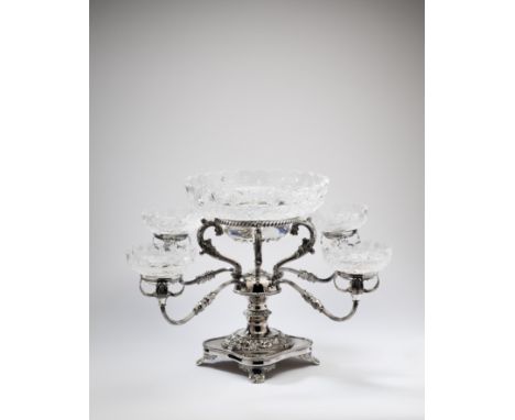 A SILVER EPERGNE / CENTREPIECE, J.W. EVANS &amp; SONS LTD., BIRMINGHAM, 1992 in George IV style, the shaped square base on an