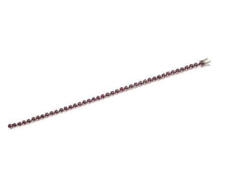 RUBY LINE BRACELET designed as a uniform line of circular-cut rubies, 16cm long
