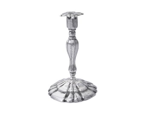 A DUTCH SILVER MINIATURE CANDLESTICK, UNMARKED, 19TH CENTURY shaped circular fluted base and fluted baluster stem, 5cm highPr