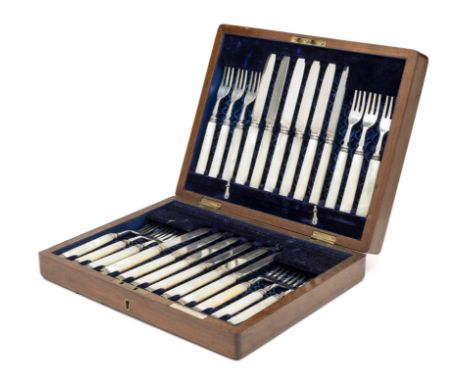 A SET OF TWELVE VICTORIAN FRUIT KNIVES AND TWELVE FORKS, WILLIAM HUTTON &amp; SONS, LONDON, 1892 with silver tines and blades