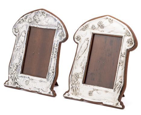 ☐ A PAIR OF EDWARDIAN SILVER-MOUNTED PHOTOGRAPH FRAMES, J. AITKIN & SON, BIRMINGHAM, 1904 each arched and shaped relief mount