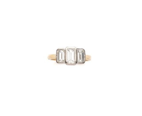 DIAMOND RING collet set with three graduated baguette diamonds, British hallmarks for 18-carat gold, London 1996, ring size K