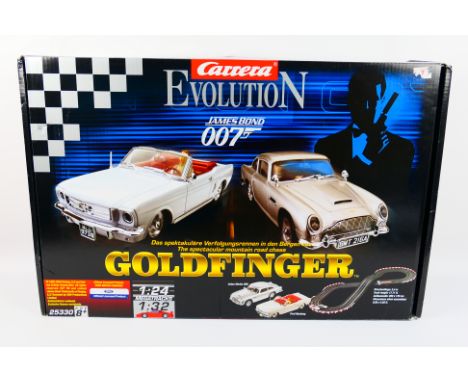 Carrera - A boxed Carrera Evolution James Bond 007 Goldfinger slot car set - The 1:32 #25330 set comes with instruction manua