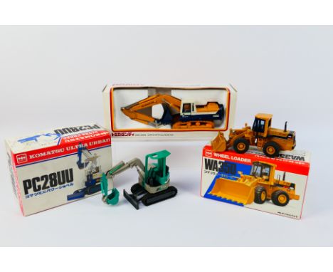 Tomica Dandy - Shinsei - 3 x boxed Komatsu construction vehicles, an Avance PC200 tracked excavator in 1:43 scale # DK-001, a