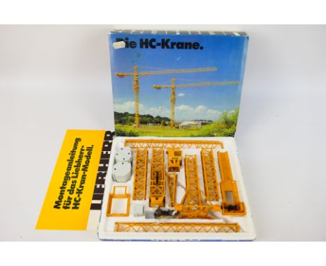 Conrad - A boxed 1:87 scale Liebherr 140 HC- revolving tower crane # 157. The model appears Near Mint in a Good box with inst