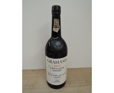 A bottle of Grahams 1975 Vintage Port, no strength or capacity started