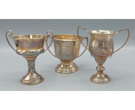 A Birmingham silver two handled trophy cup together with two other Birmingham silver trophy cups, 11ozs 