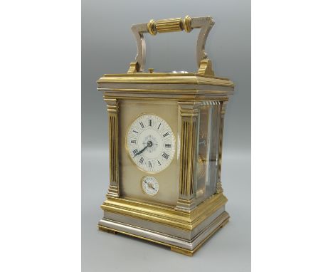 A late 19th or early 20th Century French brass and silvered carriage clock, the painted enamel dial with Roman numerals and s