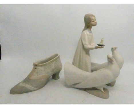 Four pieces of Lladro/Nao to include a Lladro girl with candle, Nao boot and two Nao doves, height of tallest 20.5cm (4).