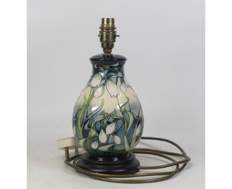 A Moorcroft lamp base decorated in the Nivalis Snowdrop pattern. (H: 30cm)