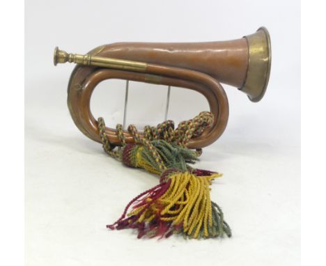Brass and Copper Bugle with red, yellow and green knotted rope.
