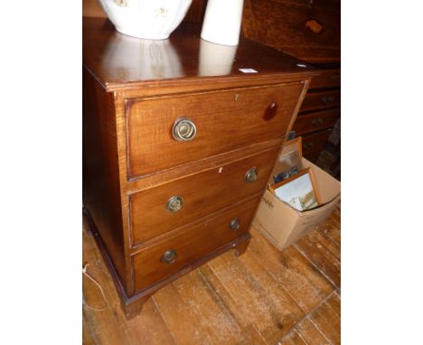 Edwardian mahogany three-drawer chest on bracket feet