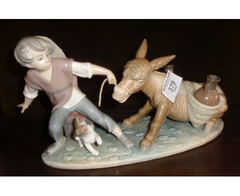 Lladro boy pulling a donkey figurine