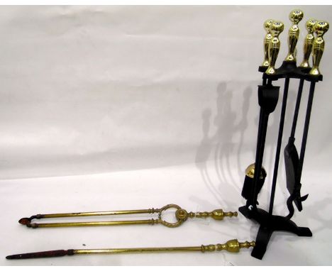 Two old brass fire tools and a modern fireside set in stand 