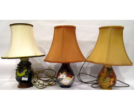 Three Moorcroft lamp bases with shades 