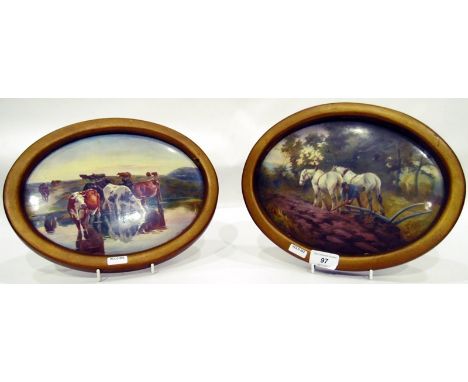 Pair of ceramic painted wall plaques, ploughing scene and cattle by lake, oval, signed 'G.Fernghough, 1901', 19.5cm x 25.5cm 