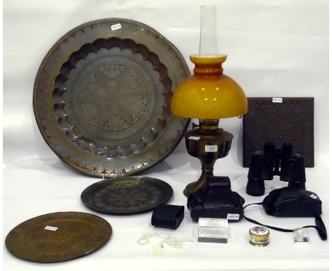 Mixed lot to include a pair of binoculars, two cameras, a circular engraved brass tray, thimbles and a brass oil lamp 